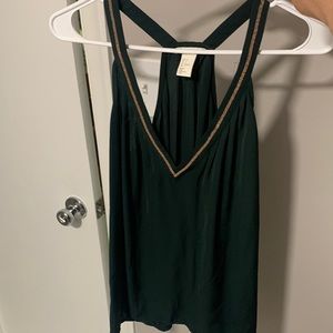 H&M green top with gold trim around the v-neck. Size 6.